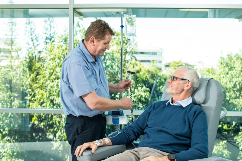 Oncologist starting chemotherapy on cancer patient