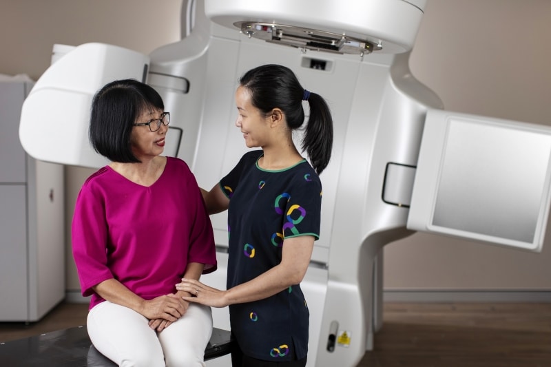 Icon expert consultant comforting a cancer patient before treatment.