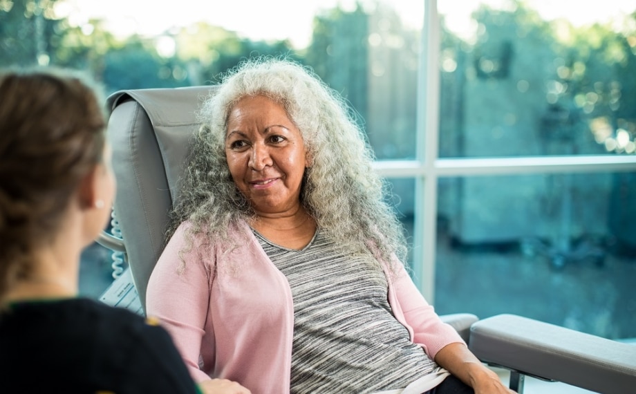 Icon Care team member consulting with cancer patient.